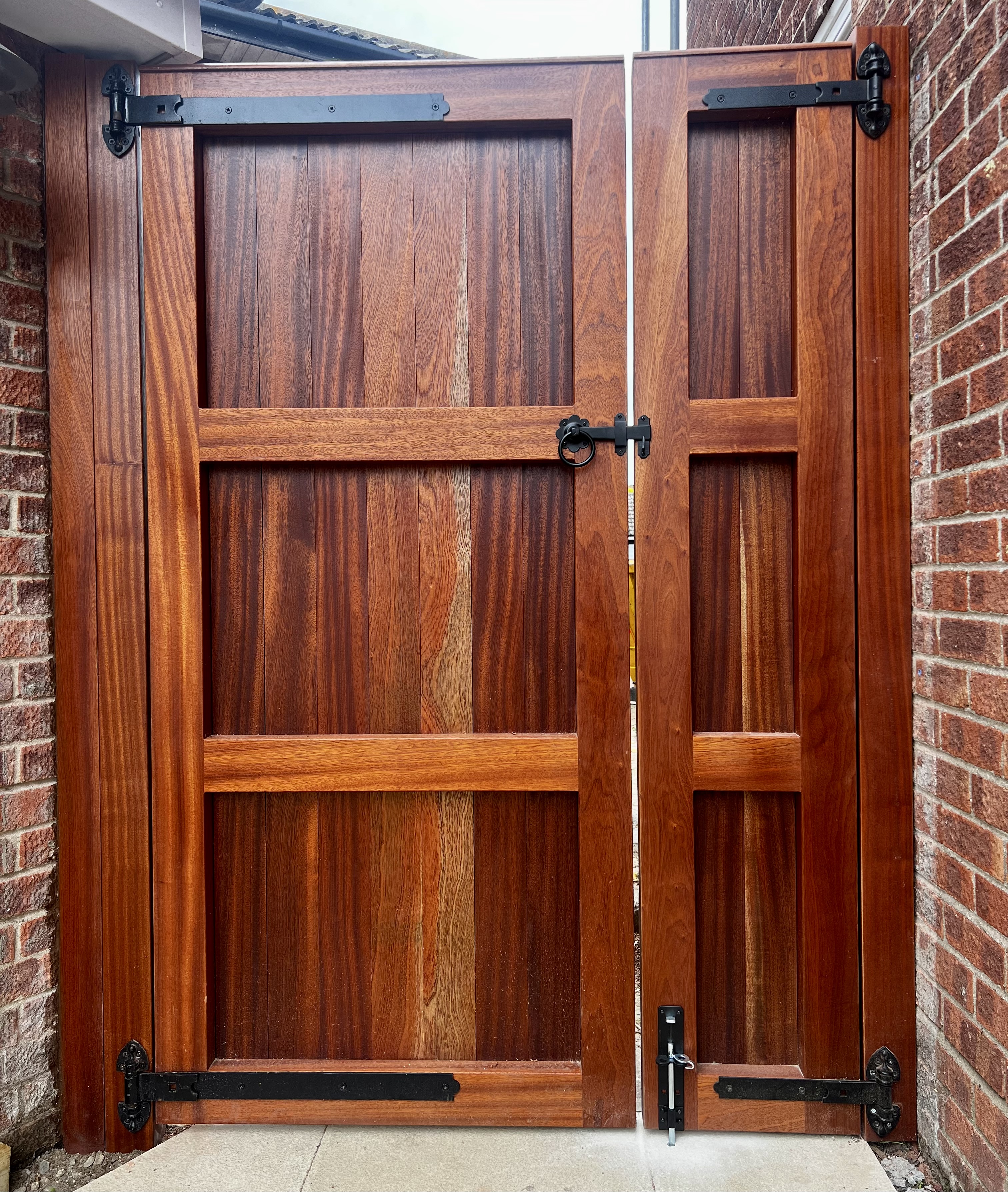Framed and panelled double garden gate in hardwood, front view